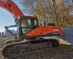 Koparko-ładowarka Doosan DX340LC-5